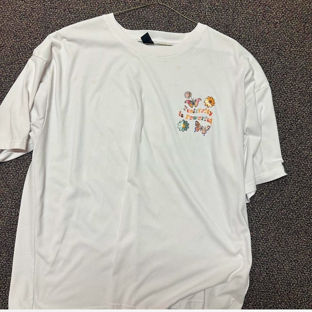 “Positivity is powerful” slogan and floral print t-shirt
